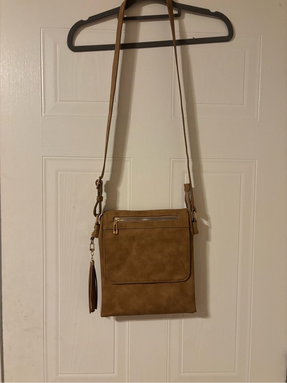 Classic Tan Crossbody Bag with Tassel Accent